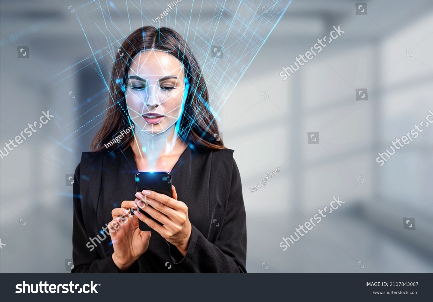 Businesswoman with phone in hands, biometric verification and face detection. Unlocking smartphone with facial scanner. Concept of face id and high tech technology #2107843007