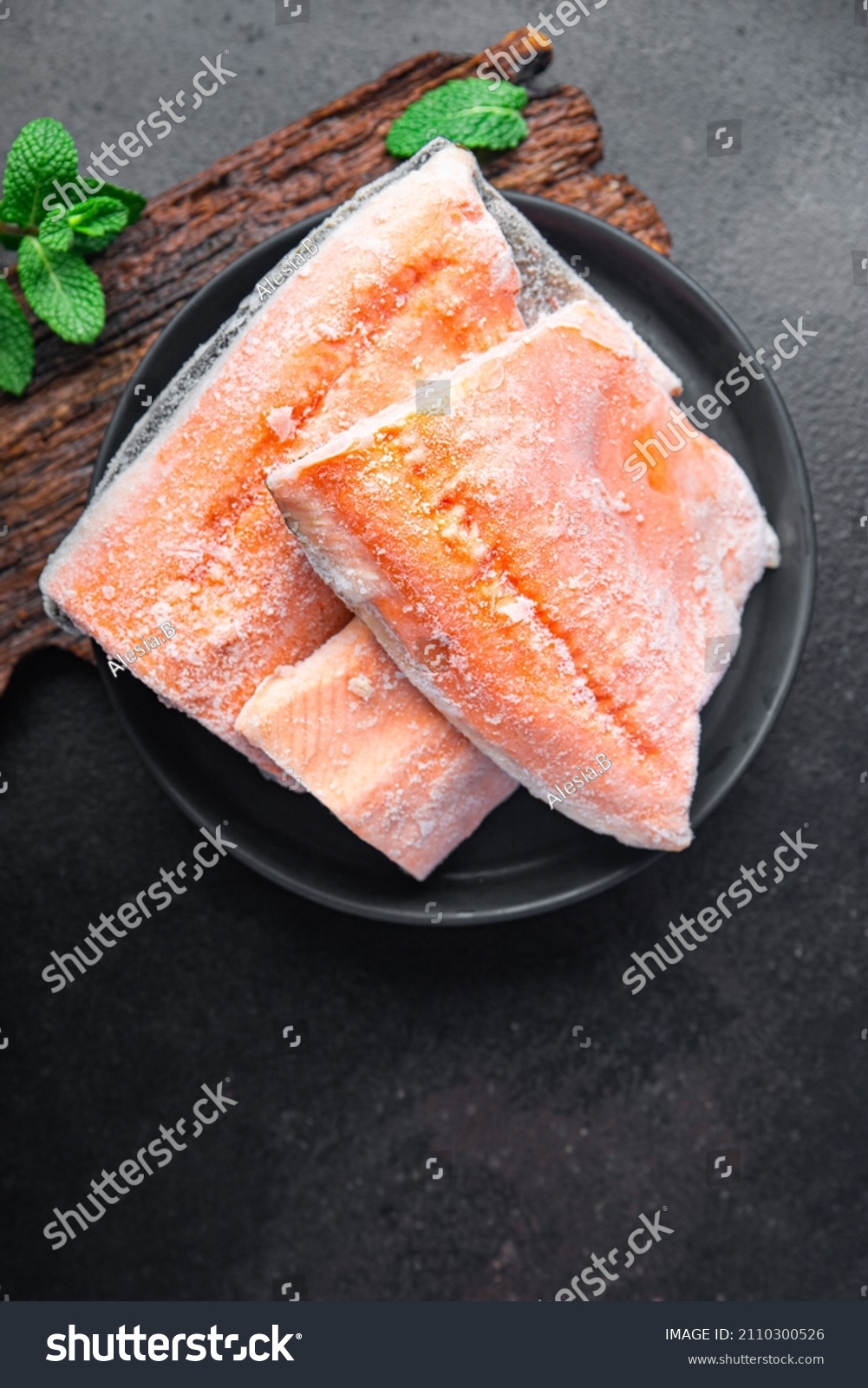 char fish frozen raw seafood freezy cooking red fish pieces long-term storage healthy meal food snack on the table copy space food background rustic top view pescatarian diet #2110300526
