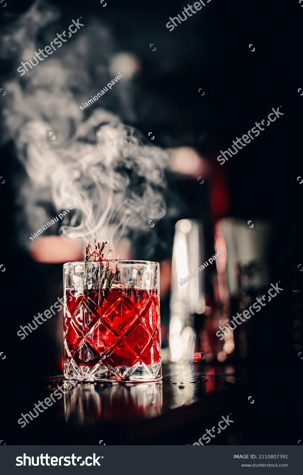 glass cocktail in bar with smoke #2110807391