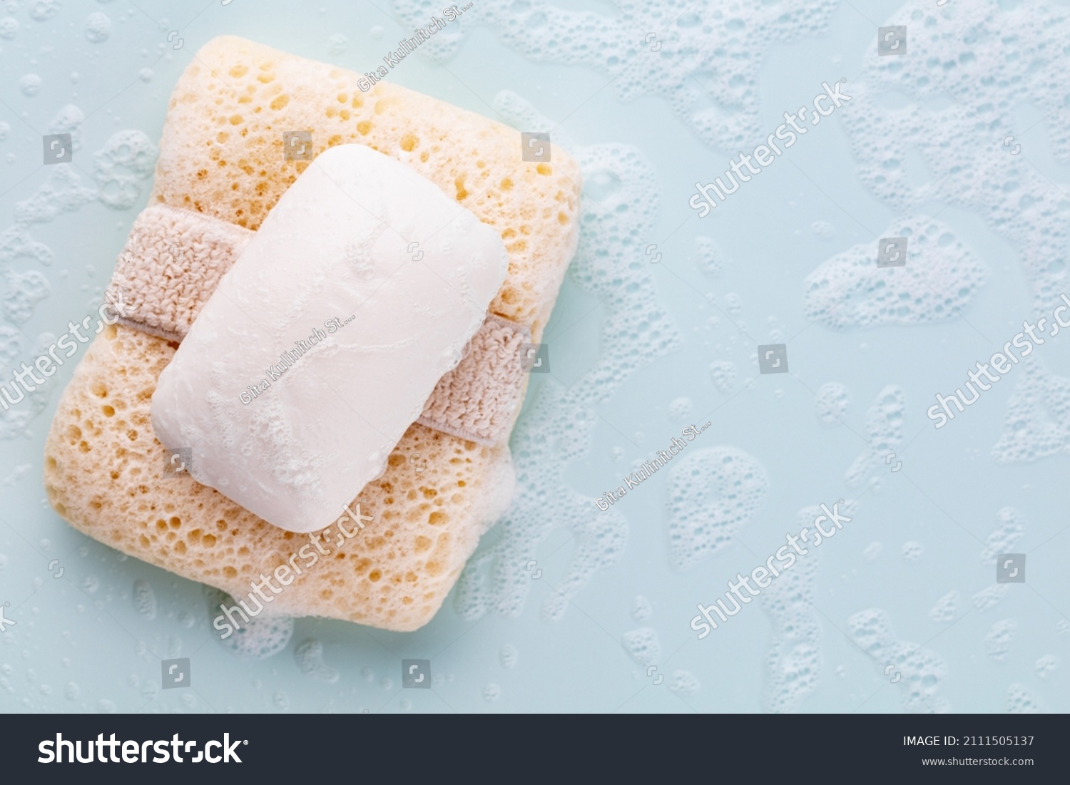 Soap bar and foam on pastel background #2111505137