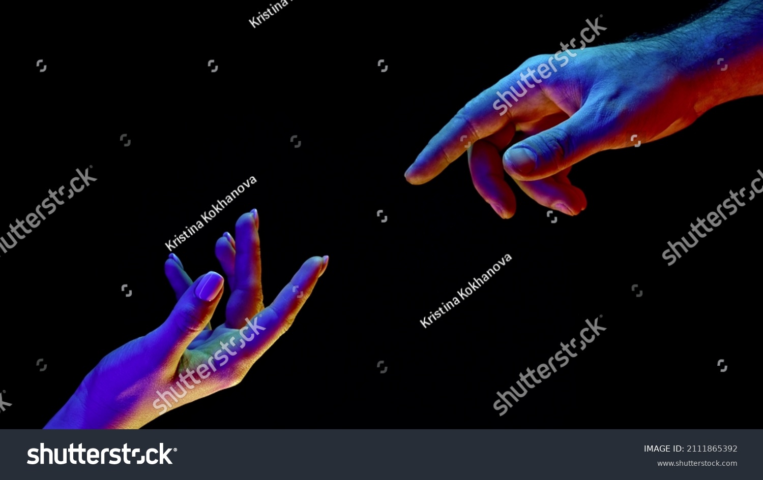 Idea of earth creation. Hands reaching out, pointing finger together on black and neon colorful light. Man and woman, love, religion. Contemporary art, evolution, origins concept. #2111865392