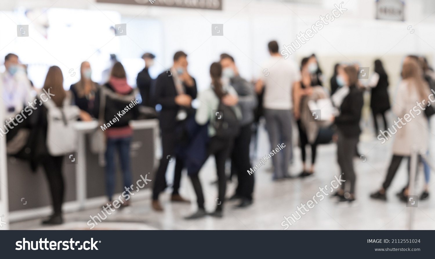 Abstract blured people at exhibition hall of expo event trade show. Business convention show or job fair. Business concept background. #2112551024