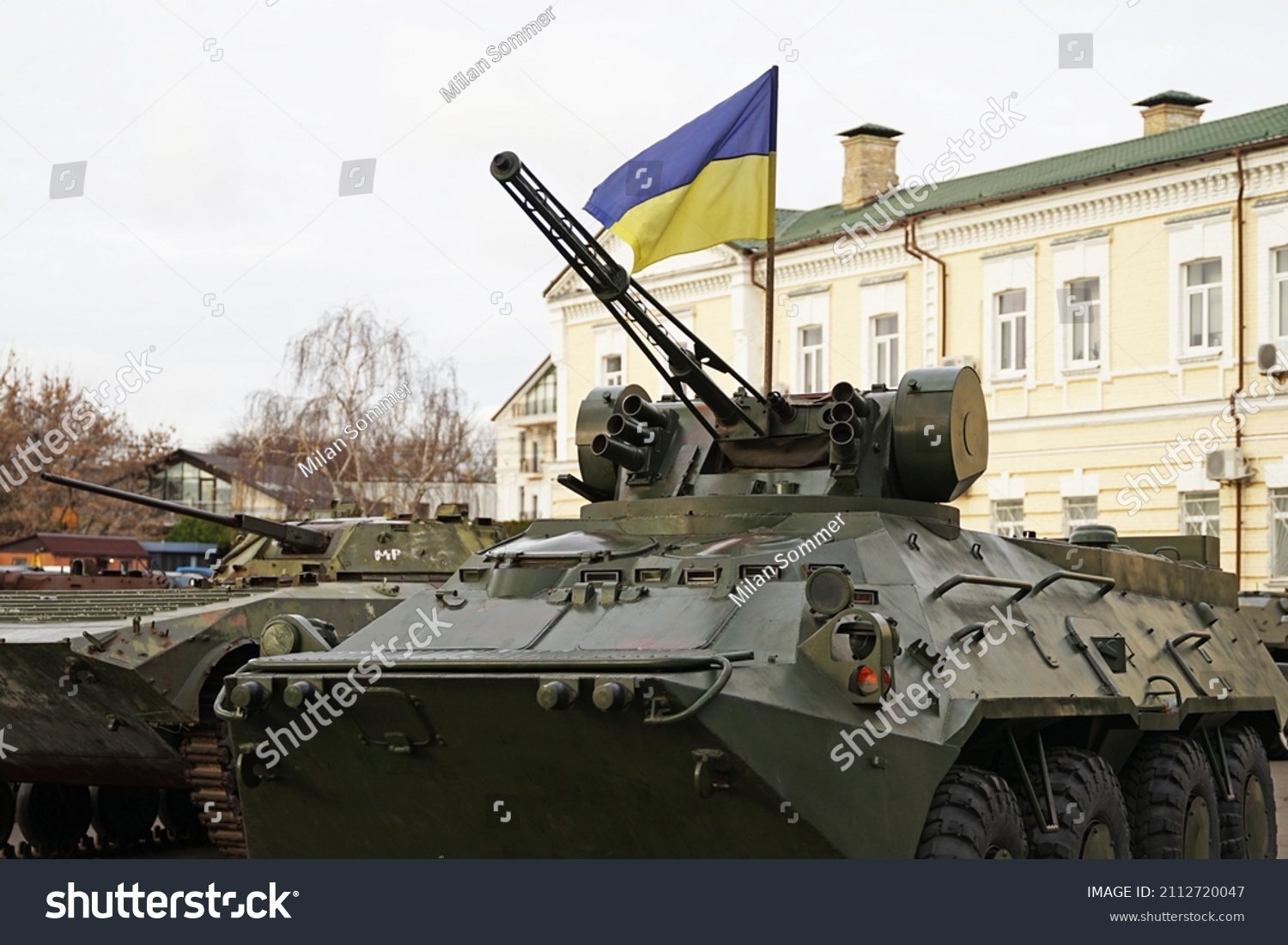 Army troops transporter and tank with Ukrainian flag, Ukraine - Russia war crisis concept, Kyiv #2112720047