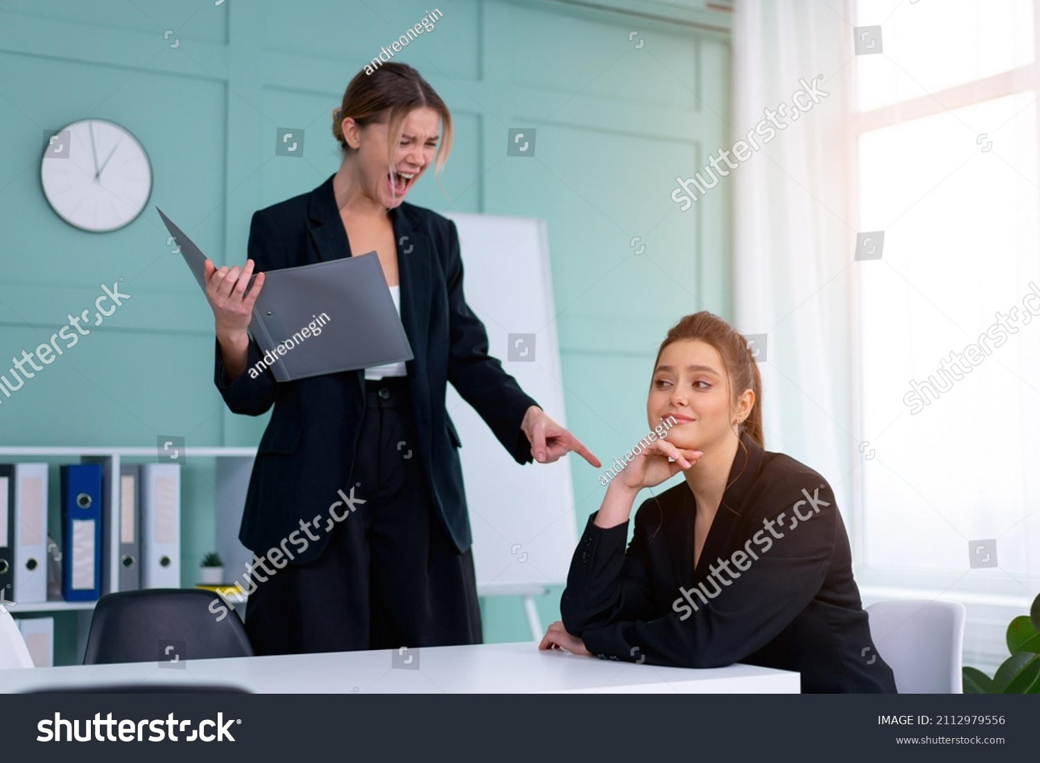 Boss screaming at frustrated employee, bullying and emotional abuse at work. Toxic work environment. Angry female irate boss yelling and shouting at his secretary employee. CEO rebuke for deadline #2112979556