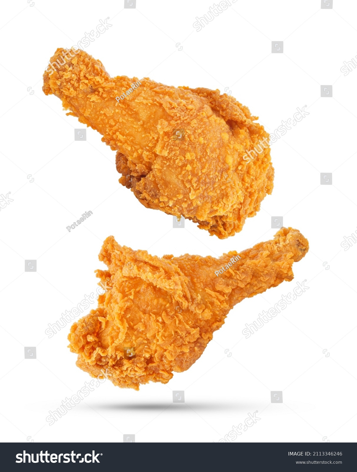 Fried chicken legs falling in the air isolated on white background. #2113346246