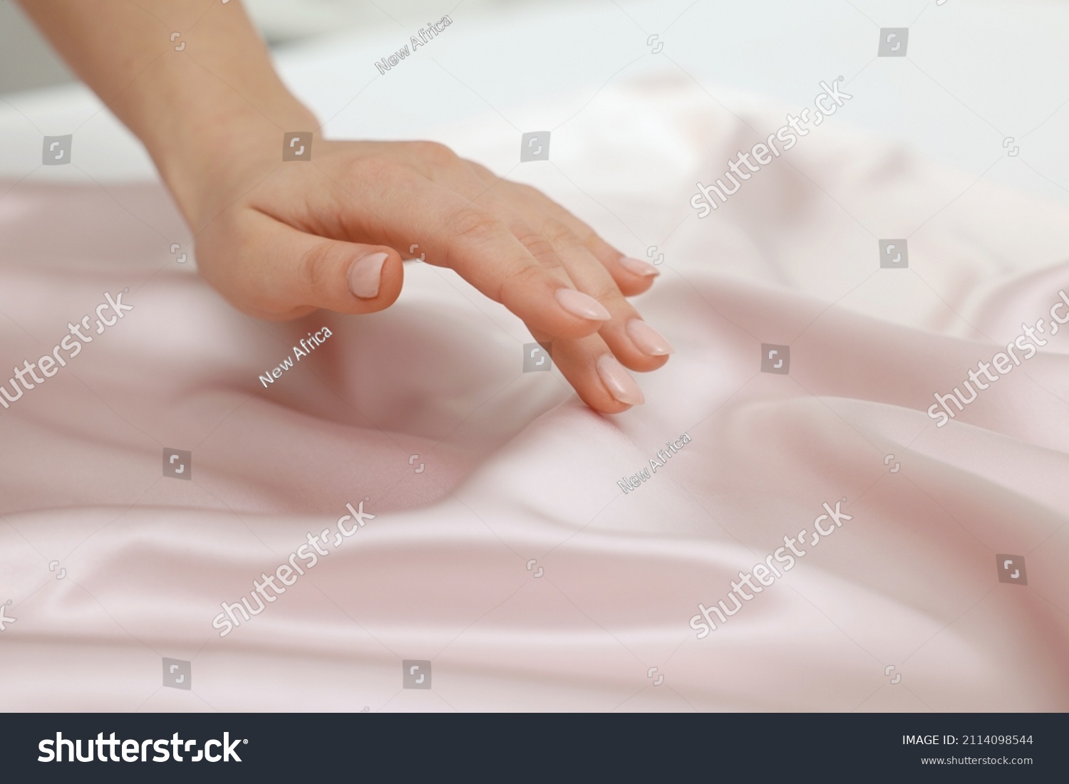 Woman touching smooth silky fabric, closeup view #2114098544