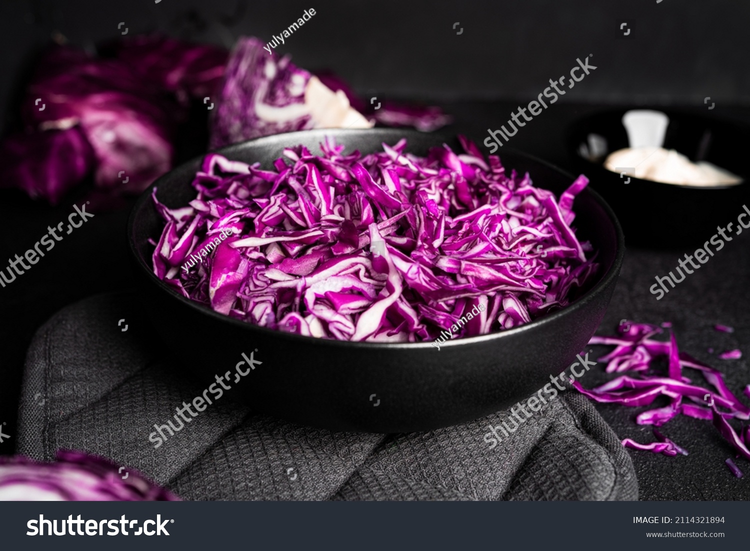Red cabbage on a dark background. Kohlrabi red cabbage salad with homemade mayonnaise. High quality photo #2114321894
