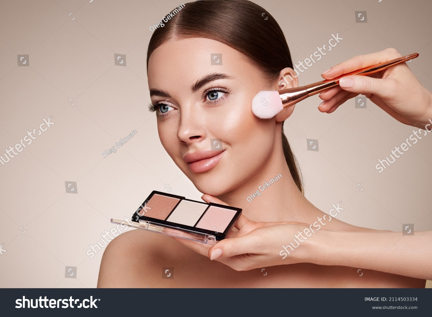 Makeup Artist applies Eye Shadow. Beautiful Woman Face. Perfect Makeup. Make-up detail. Beauty Girl with Perfect Skin. Nails and Manicure. Eye Shadow Palette #2114503334