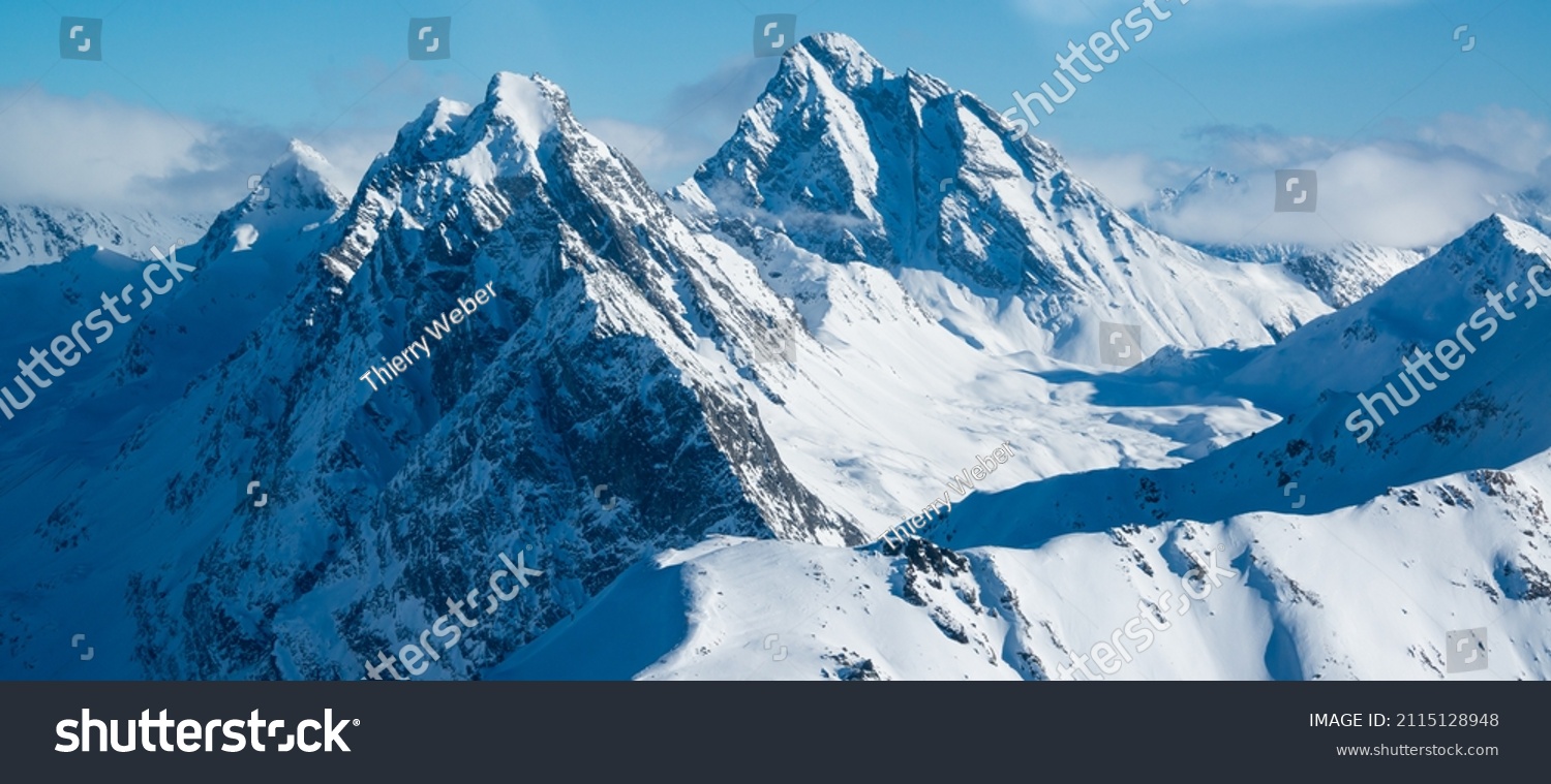 panoramic view over the swiss alps with snowy mountain summits. #2115128948