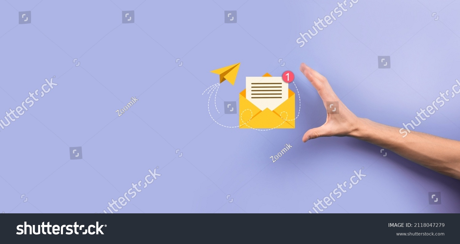 Businessman hand holding letter icon,email icons.Contact us by newsletter email and protect your personal information from spam mail.Customer service call center contact us.Email marketing newsletter #2118047279