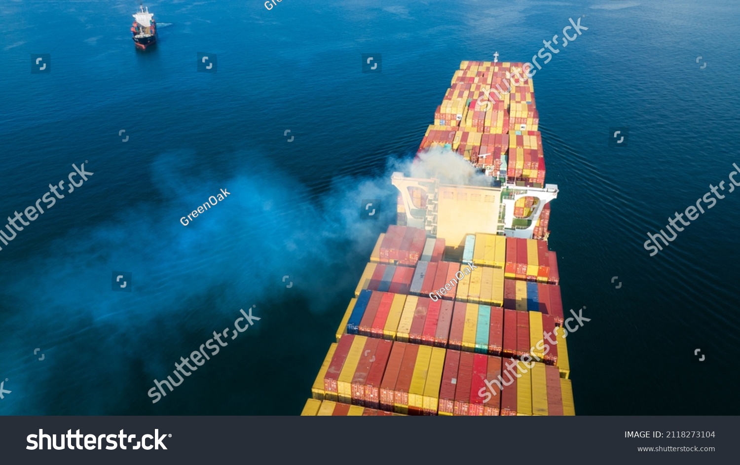 Stern of large cargo ship with Smoke exhaust gas emissions from cargo lagre ship ,Marine diesel engine exhaust gas from combustion. #2118273104