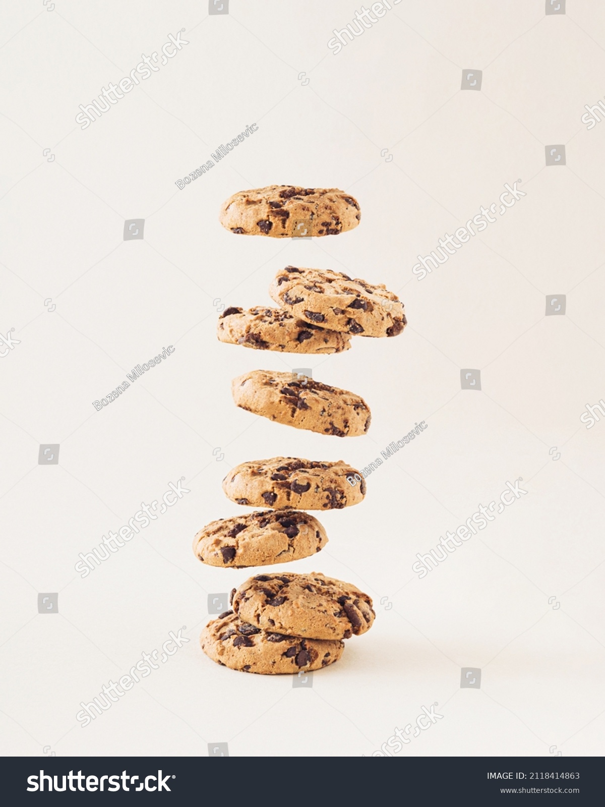 Chocolate chip cookies on the cream background. Sweet food biscuit concept. #2118414863