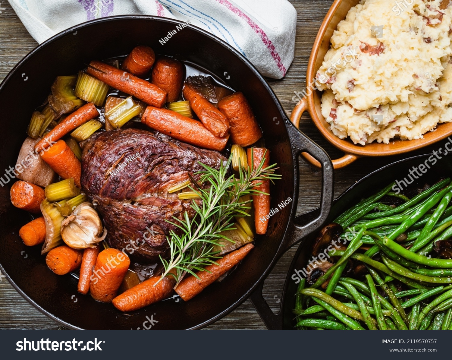 Pot roast in a cast iron dutch oven, green beans and mushed potato. #2119570757