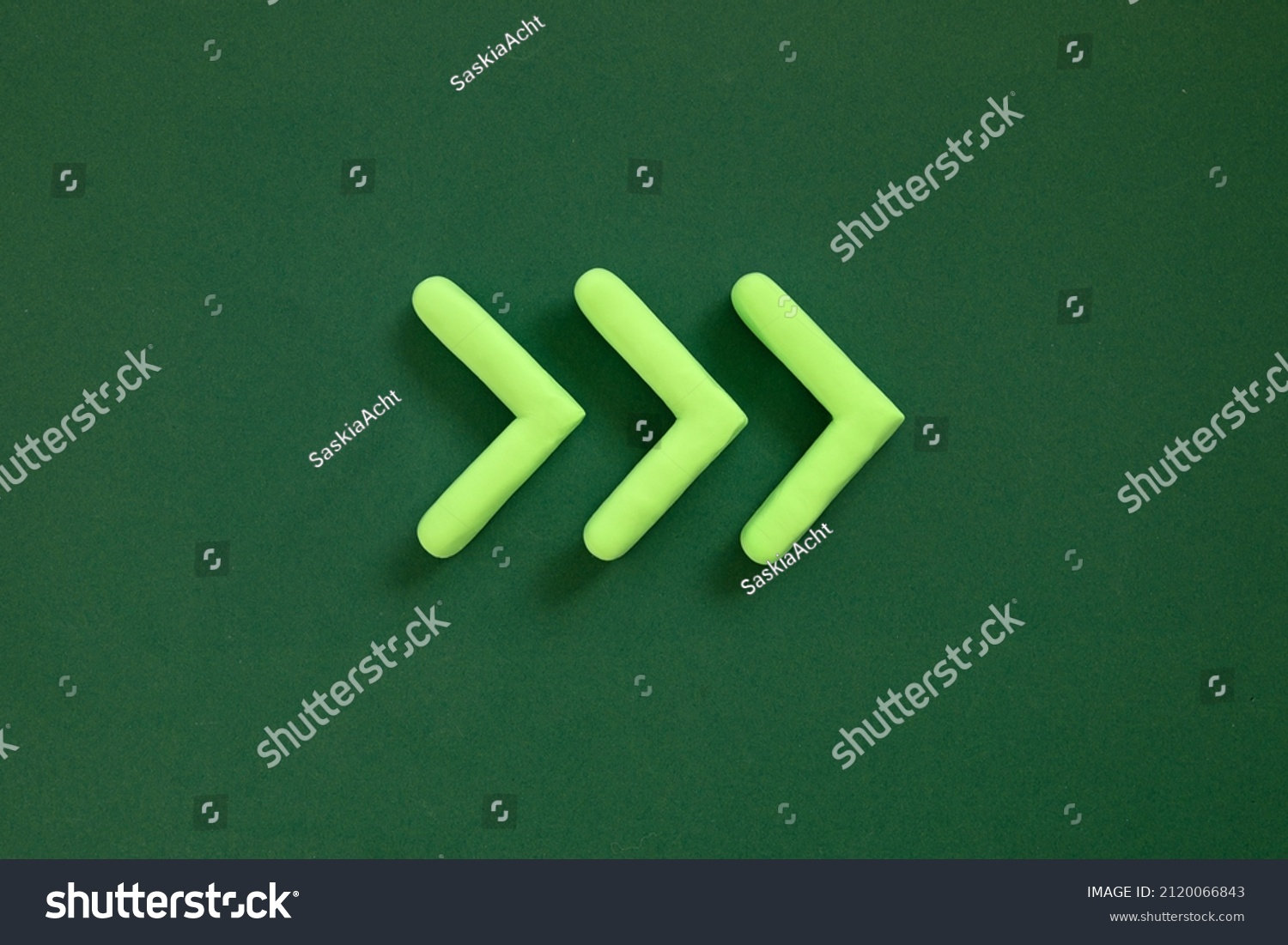 Arrows pointing right side. 3D mockup, pointer sign pointing direction on green background. Right way concept. #2120066843