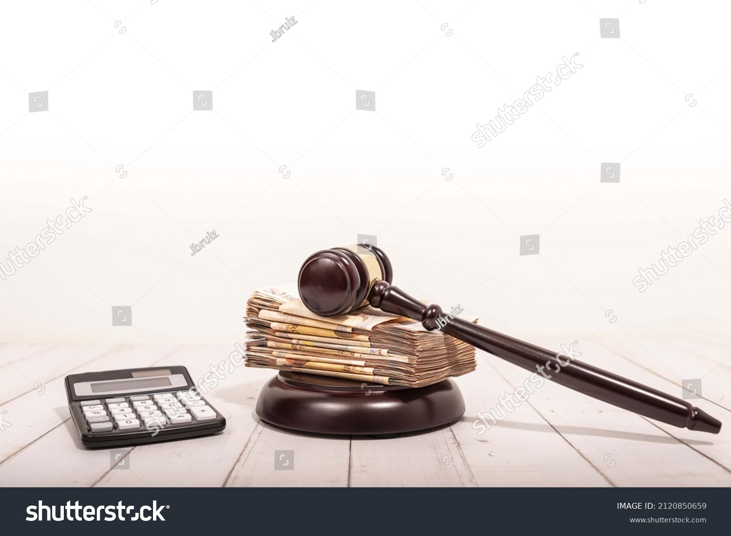 Compensation and judge's gavel. Award of moral financial compensation for caused damage. Lawyer services. Workers rights protection. Raising wages. Determination of payments by a court order. #2120850659