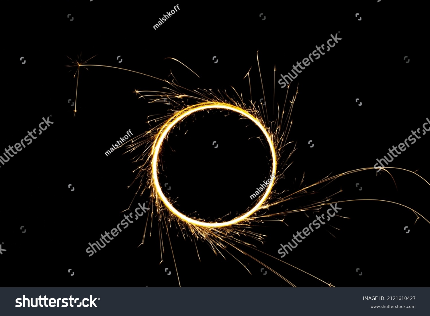 Circular lights with sparks on a black background #2121610427