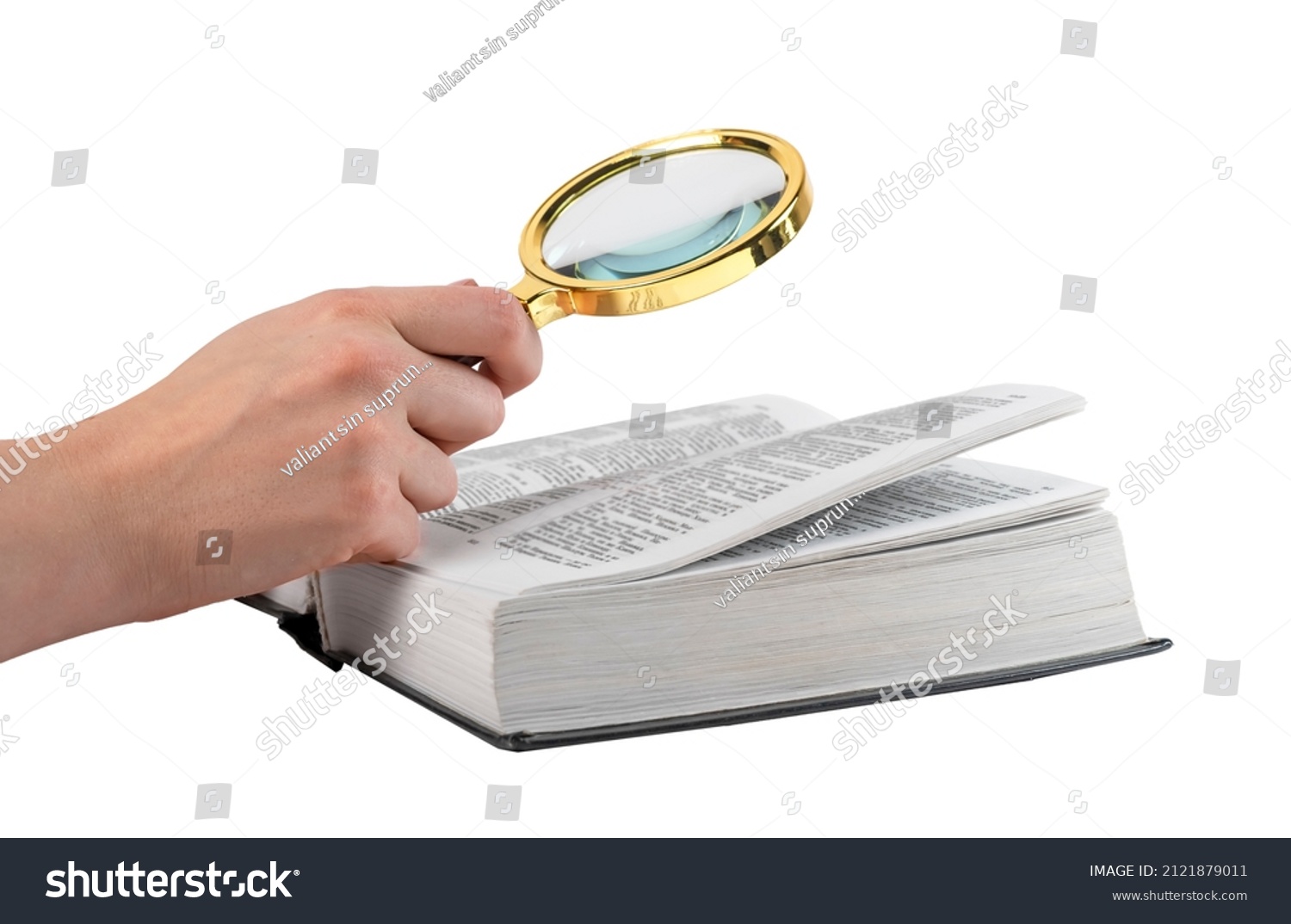 Hand holding magnifying glass for reading book isolated on white background. Relevant information search, study concept. High quality photo #2121879011