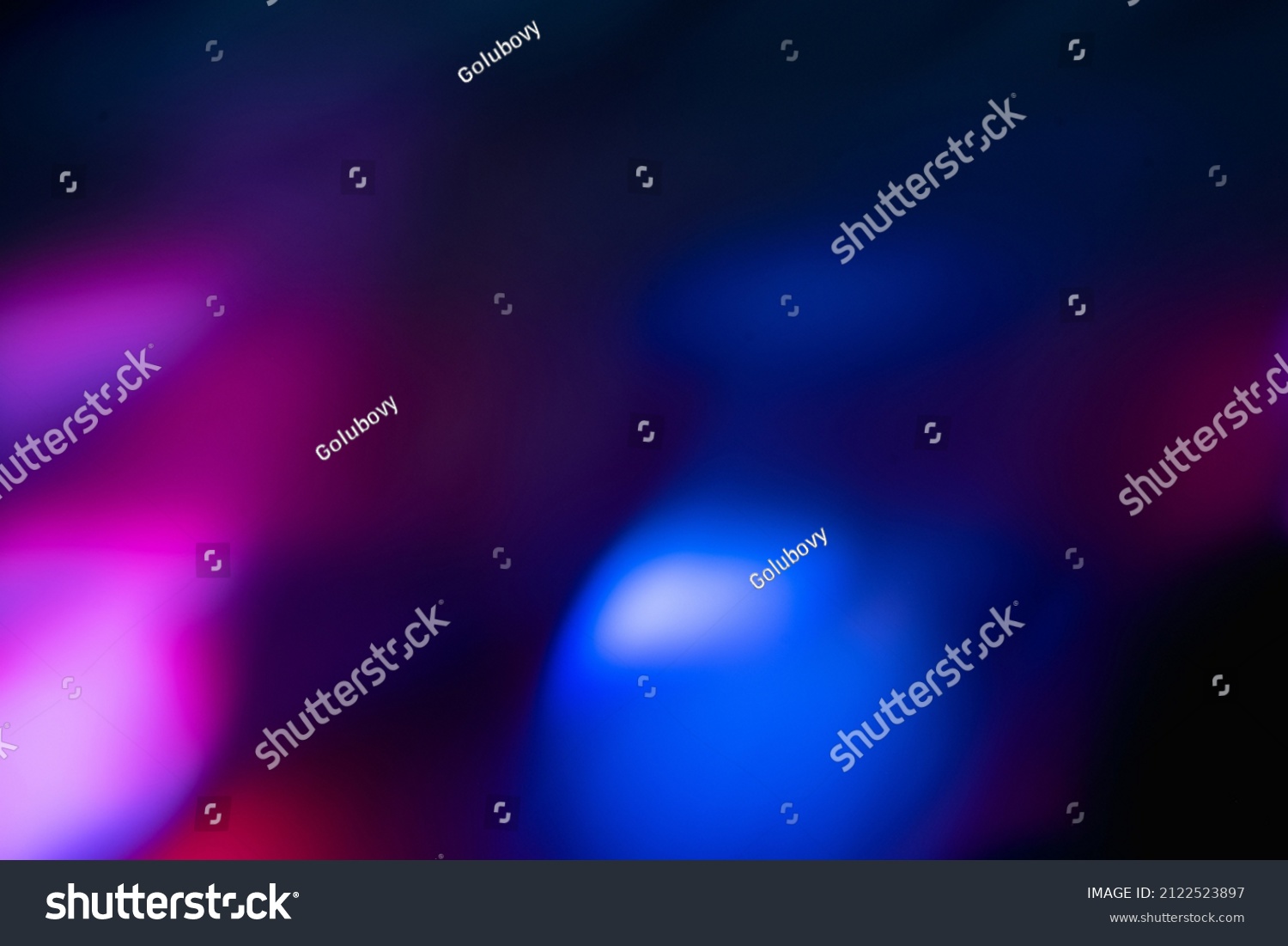 Blur neon light. Lens flare overlay. Bokeh fluorescent flash gleam. Defocused blue purple color flecks on dark black abstract background. #2122523897