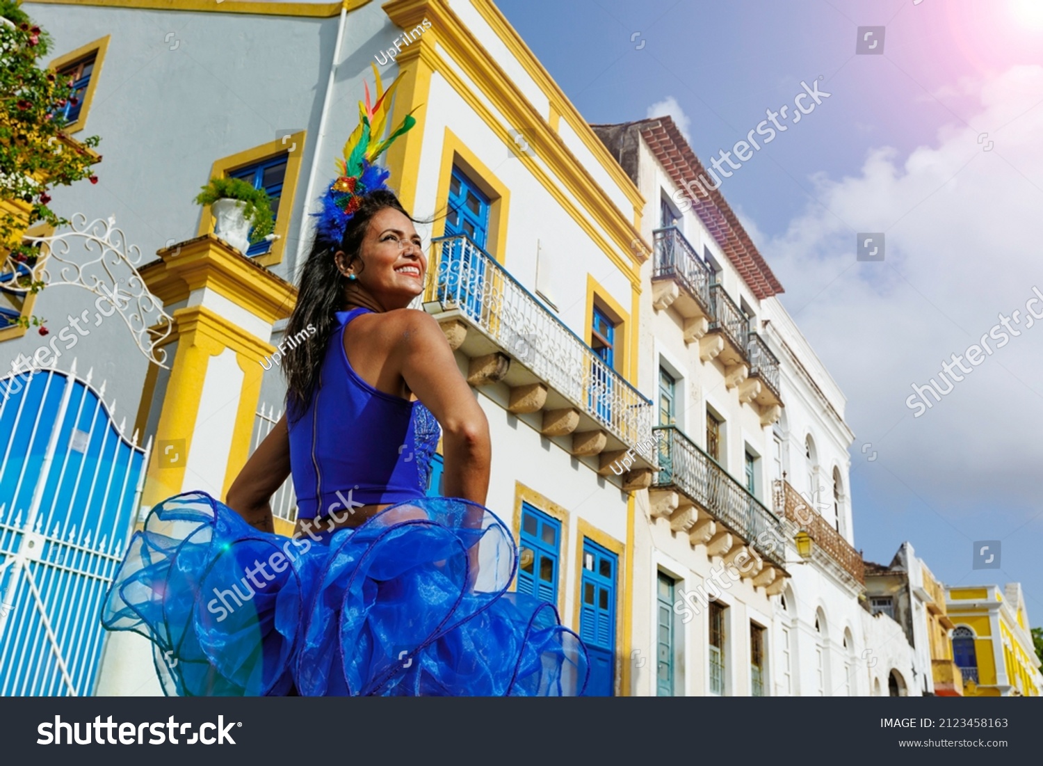 Beautiful Latin dancer dressed up for Carnival on the streets of Olinda. Frevo Recife. Brazil colors. Historical city. #2123458163