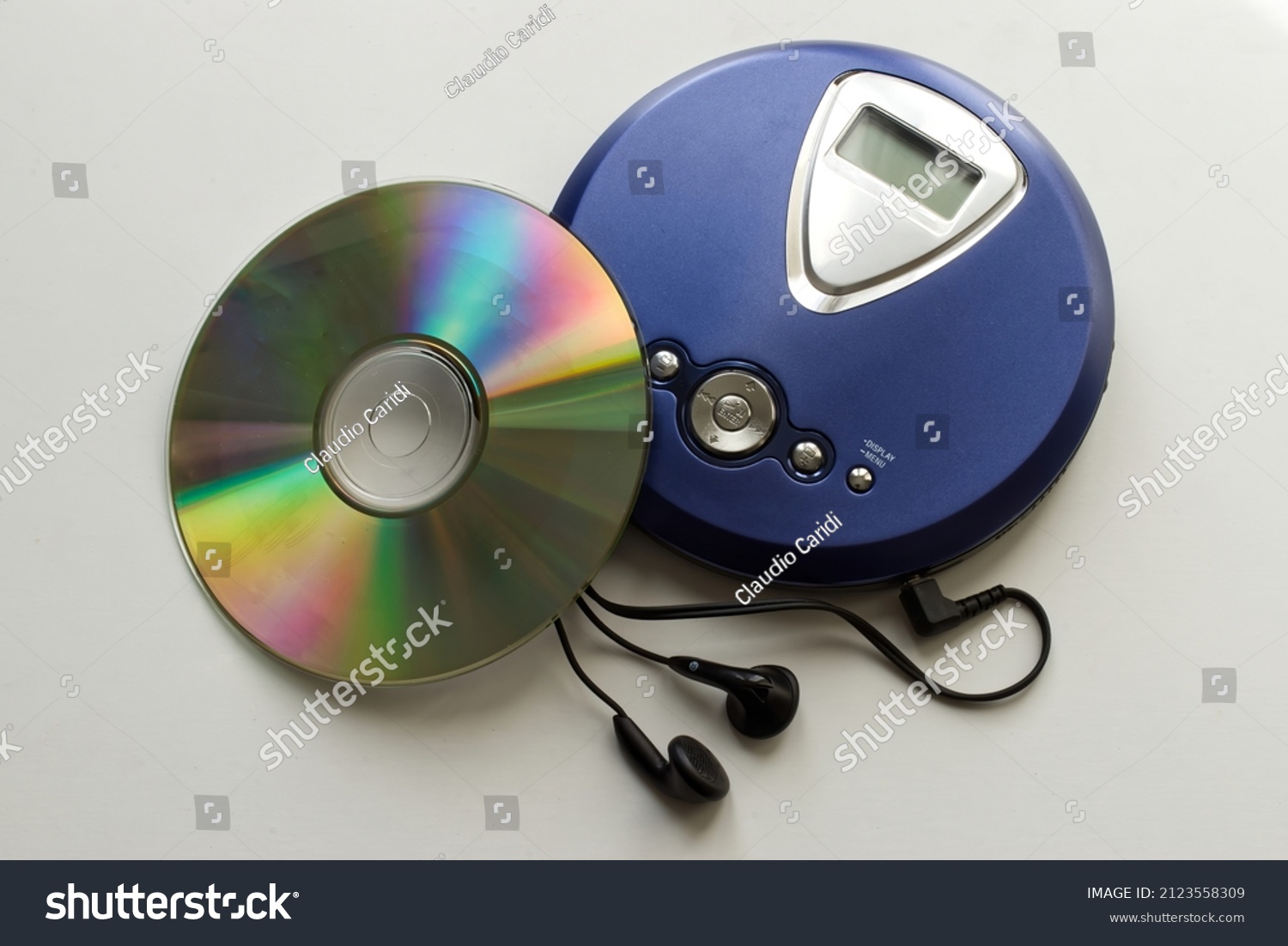 Vintage CD Player with headphones isolated on white background. Vintage Technology from the 90s. #2123558309