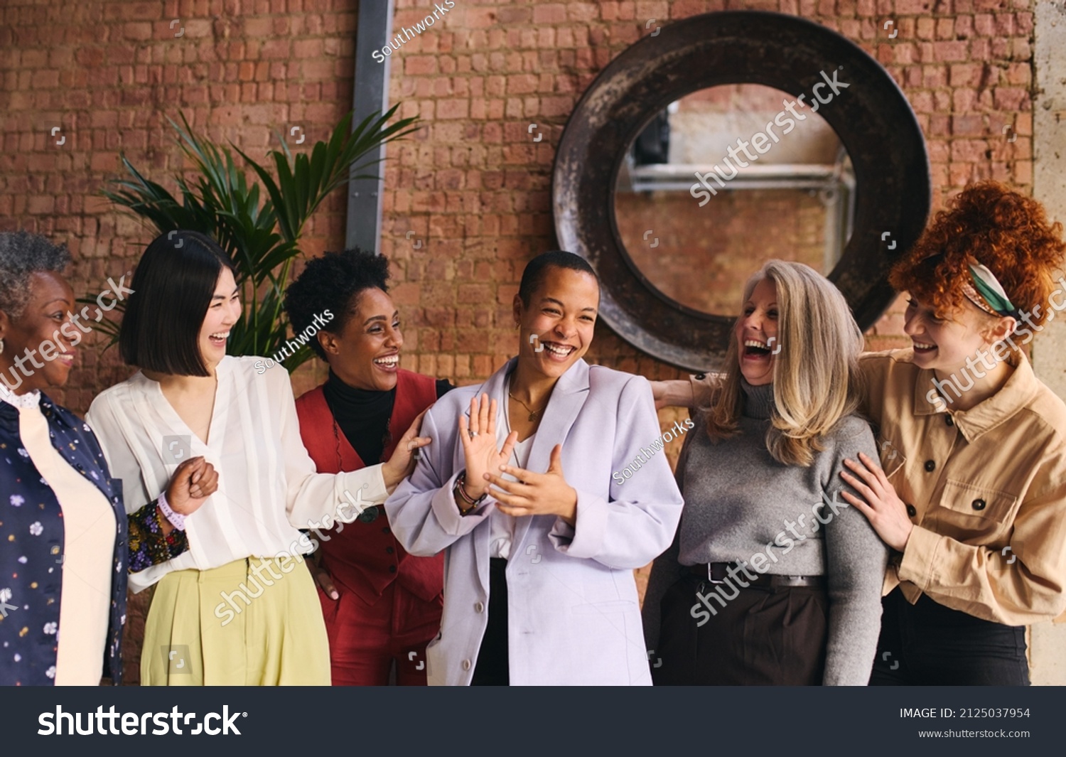 International Women's Day portrait of cheerful multiethnic mixed age range businesswomen celebrating, Embrace Equity #2125037954