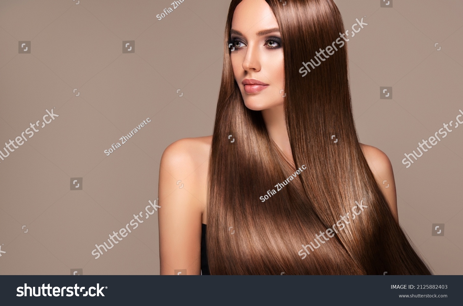 Beautiful model girl with shiny brown and straight long  hair . Keratin  straightening . Treatment, care and spa procedures. Smooth hairstyle
 #2125882403