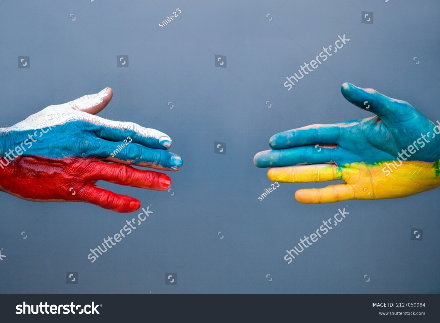 Flags of Ukraine and Russia The flag on the hands move away from each other. Conflict Ukraine vs Russia in World War Crisis Concept #2127059984