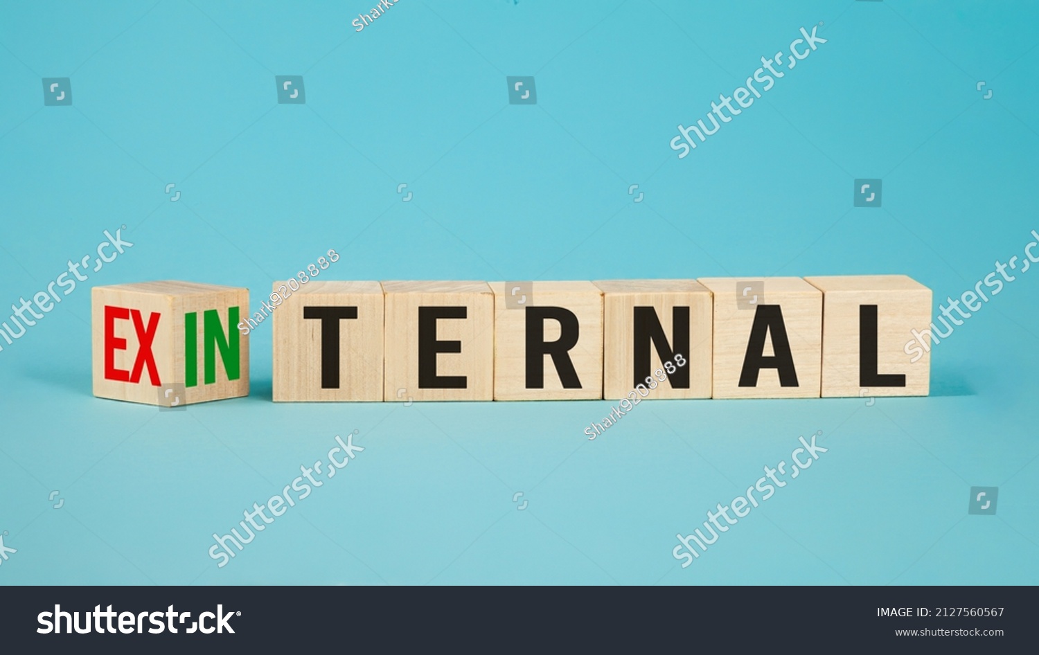 External and internal on wooden cubes, dice or blocks showing the words external and internal on blue background.Business concept. #2127560567