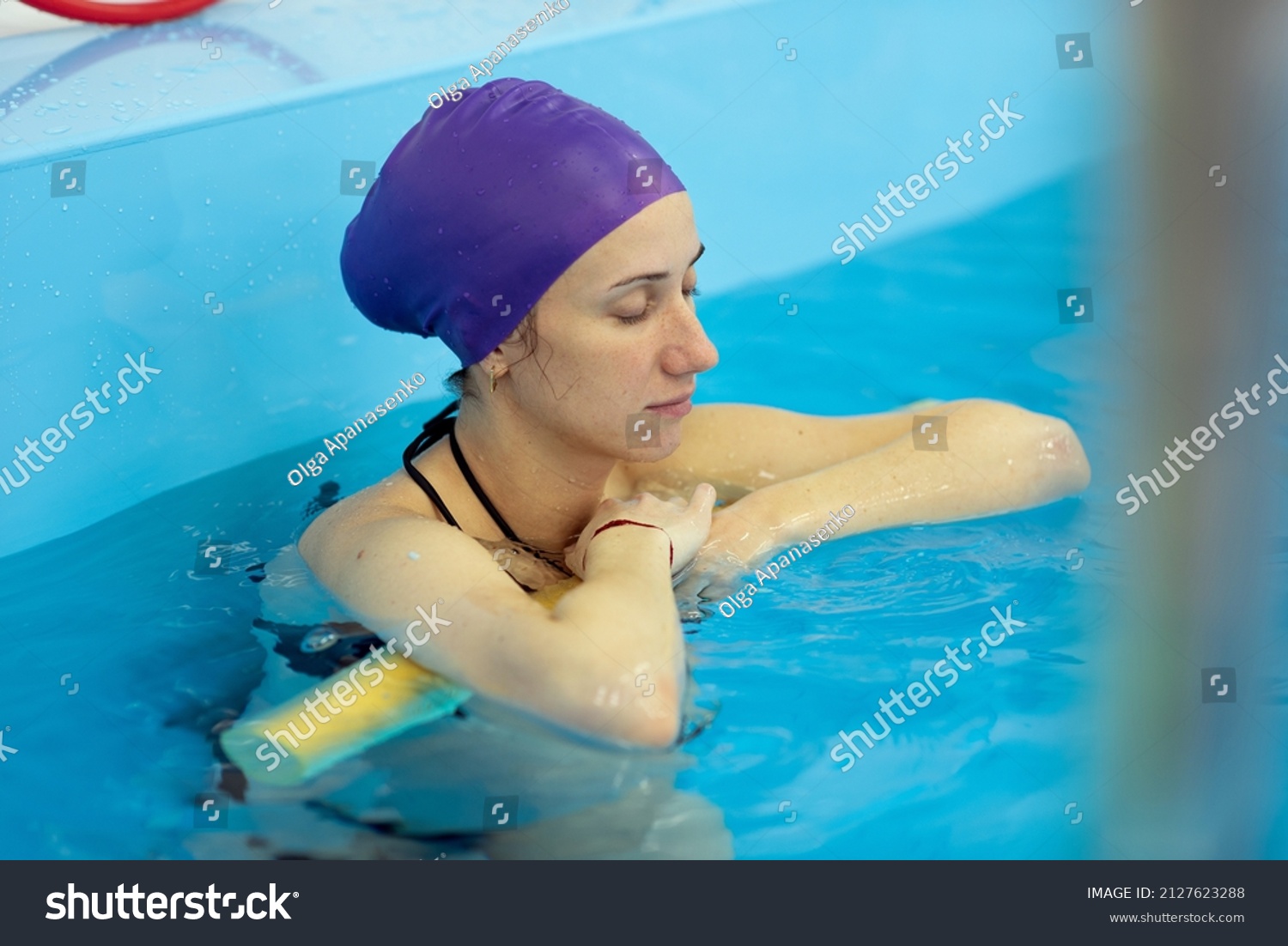 A young girl is engaged in aqua yoga in the pool. Swimming for pregnant women. Health concepts #2127623288
