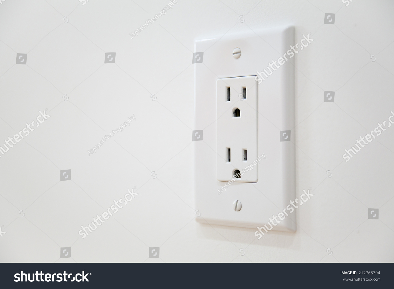 White Electrical Outlet and Wall Plate at the white wall #212768794