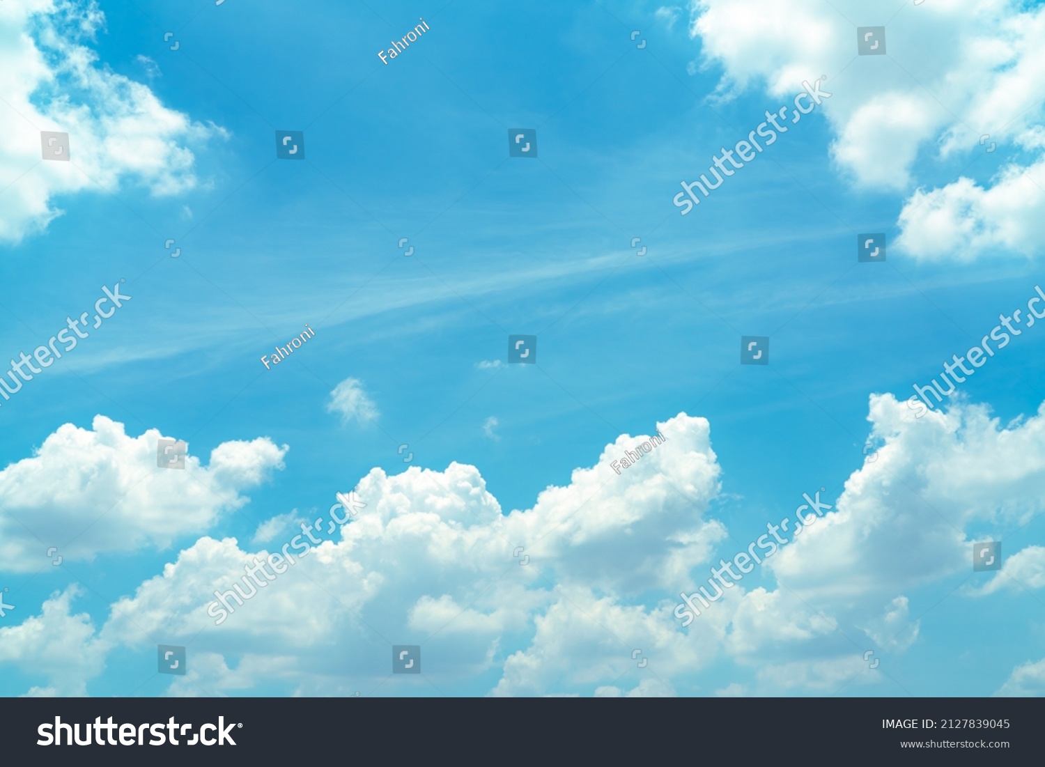 Beautiful blue sky and white cumulus clouds abstract background. Cloudscape background. Blue sky and fluffy white clouds on sunny day. Nature weather. Beautiful blue sky for happy day background.  #2127839045