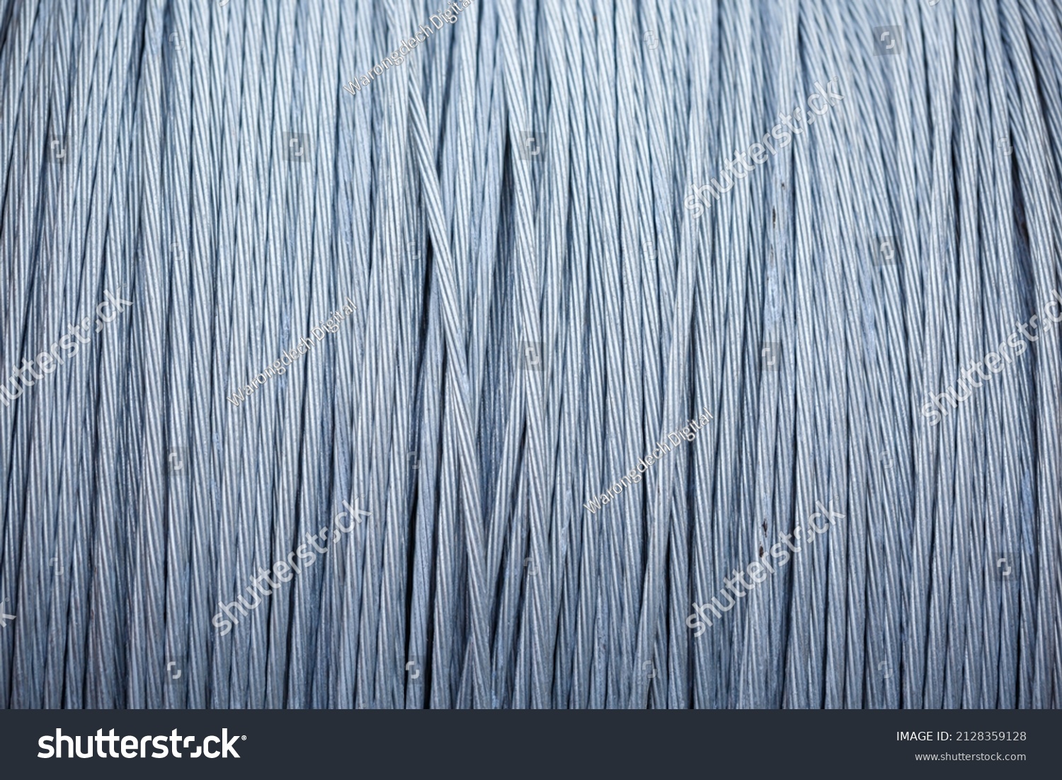 large coil of steel cable, steel braided cable is wound into a roll. #2128359128