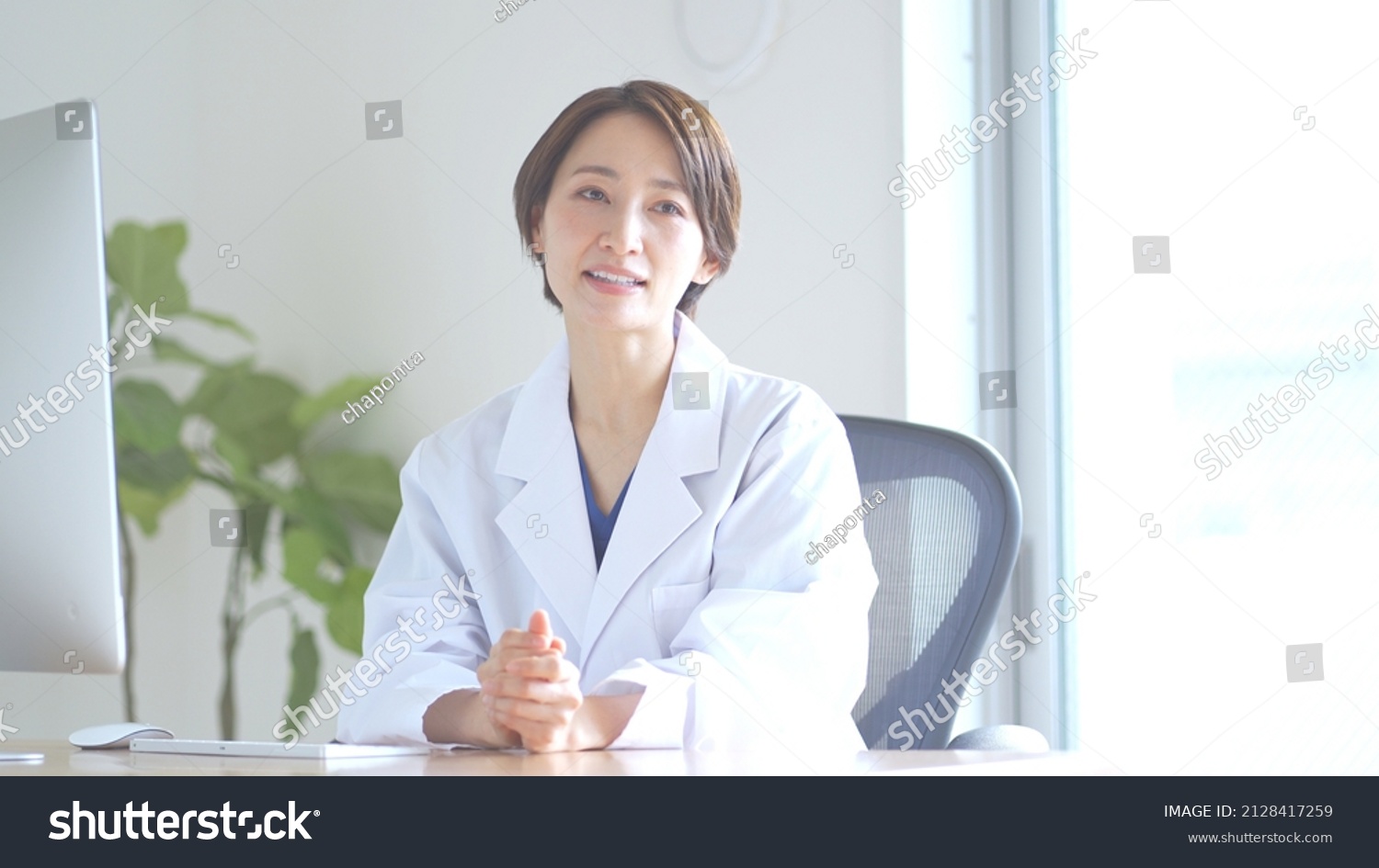 Japanese female doctor counseling indoors #2128417259