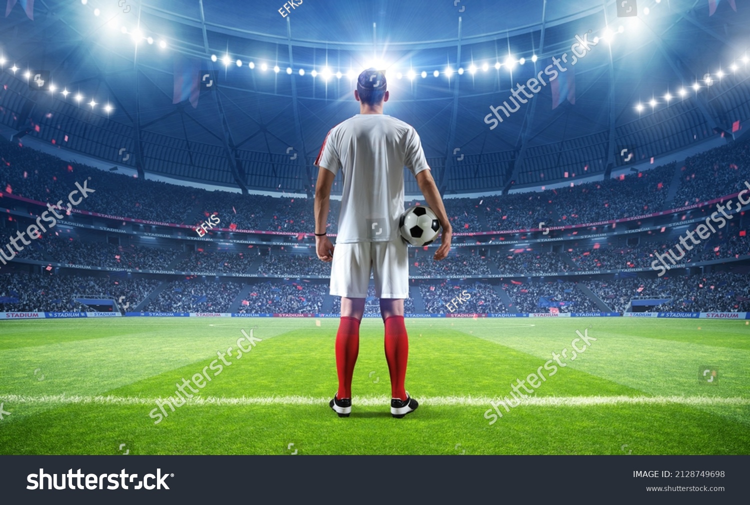 Football player with ball in the stadium, 3d rendering #2128749698
