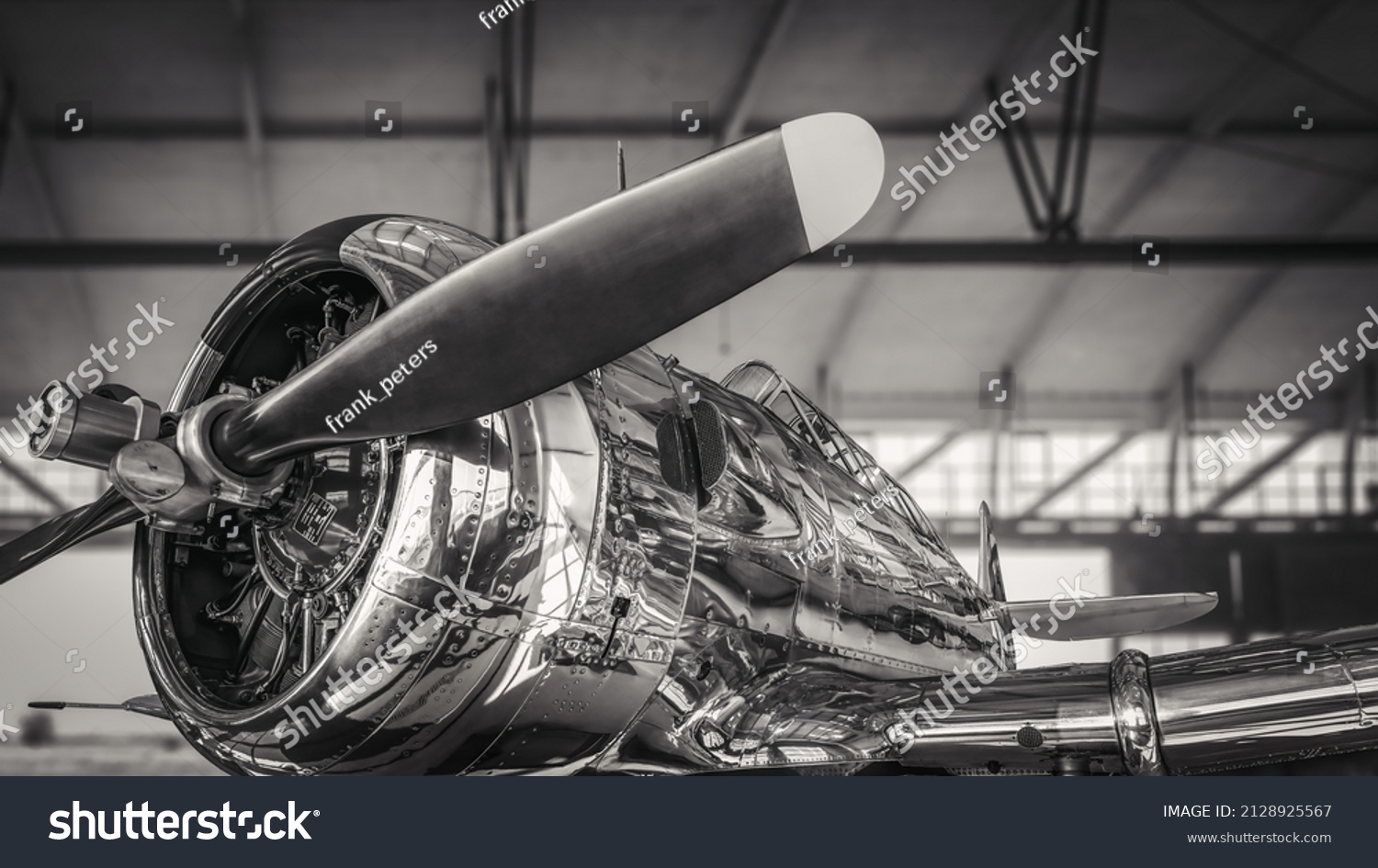 historical aircraft in a hangar #2128925567