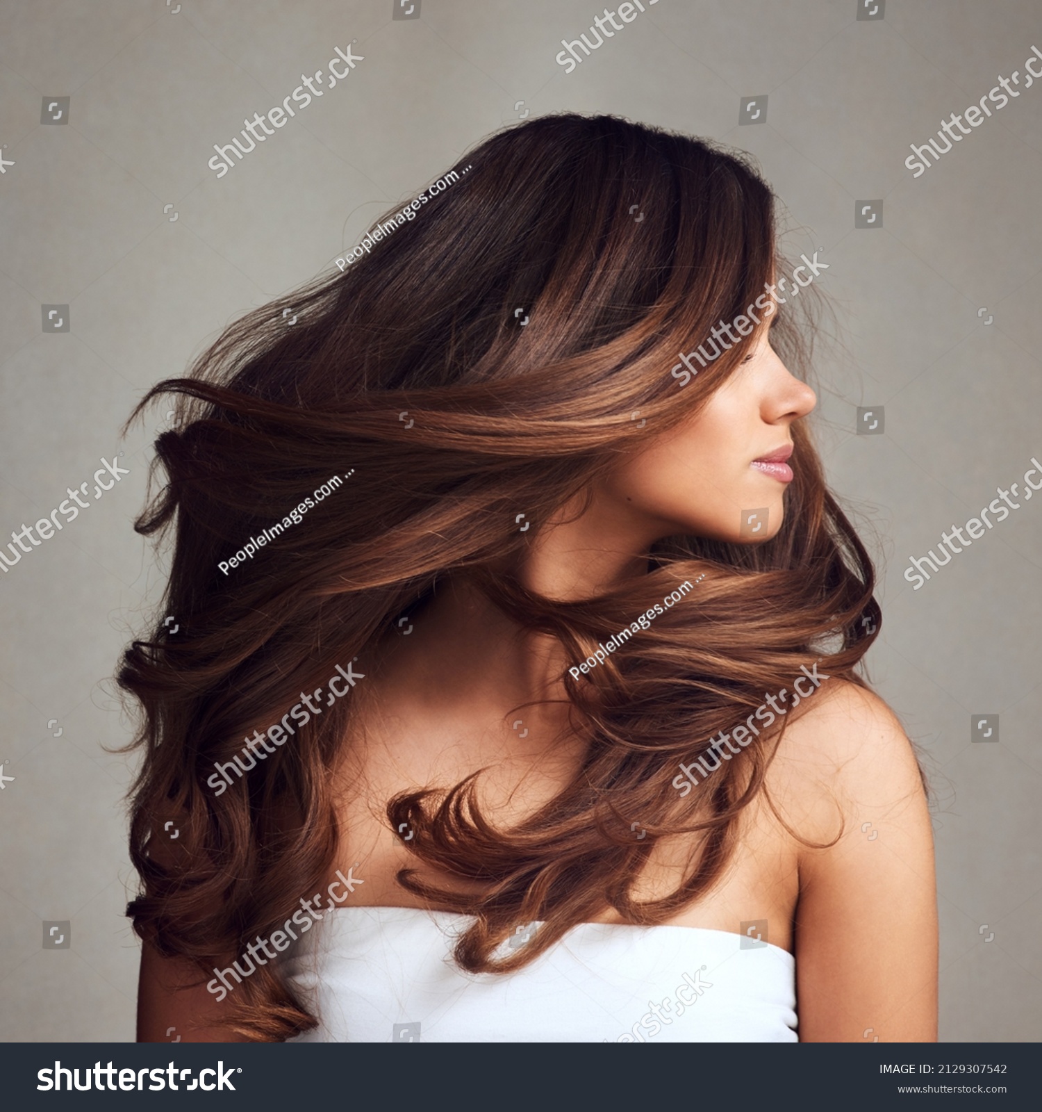 Beautiful Hair swinging head from side to side, Young beautiful woman with long perfect healthy lovely shiny hair, happy with beauty products, hair shampoo or conditioner #2129307542