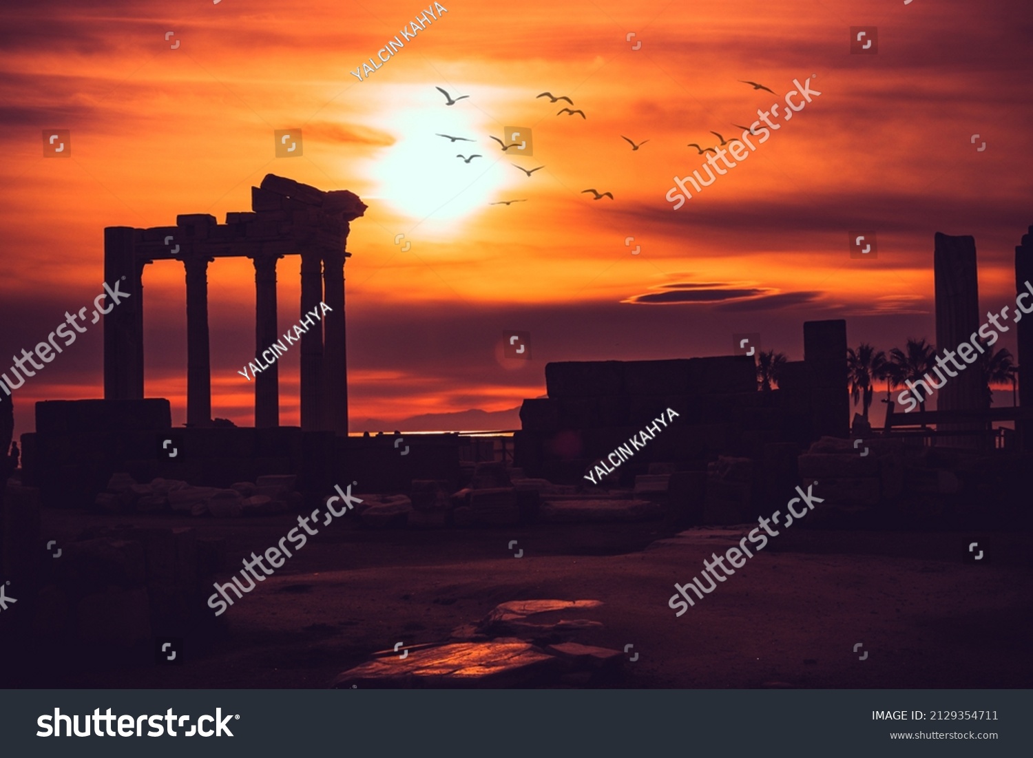 Silhouette of Apollon Temple in Side antique city, temple of Apollon ancient ruins at sunset. Greek ancient historical antique Side Antalya Turkey. #2129354711