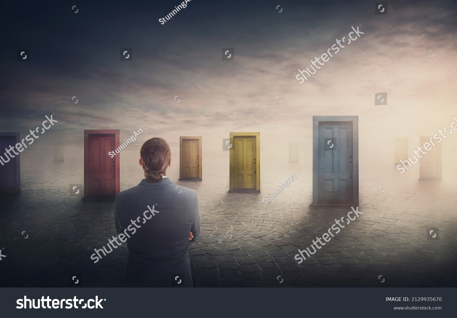 Doubtful businessman in front of multiple doors of diverse colors as symbol for different opportunities. Business challenge, choosing a correct doorway. Difficult decision concept, failure or success #2129935670