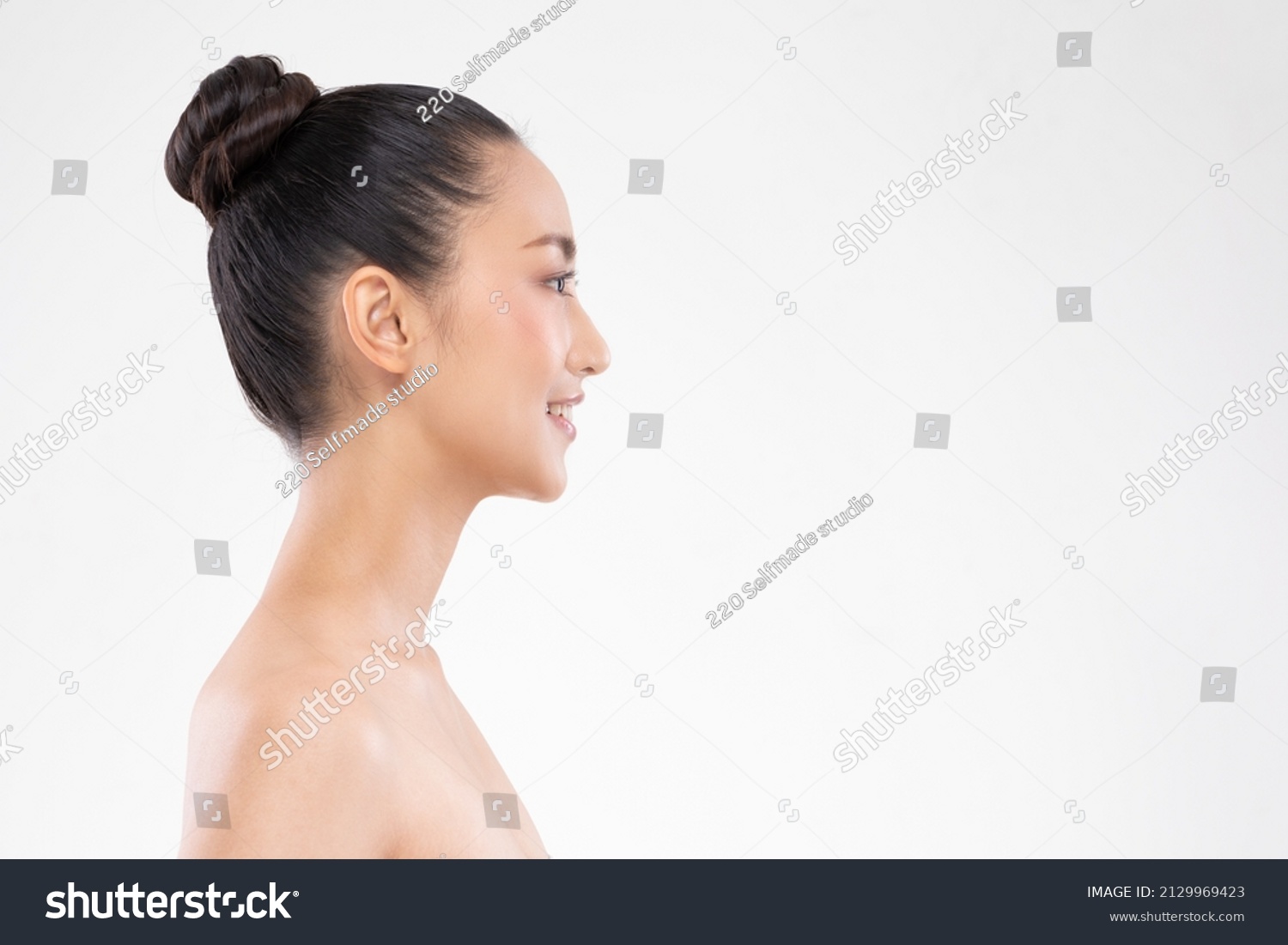 Side view of Beautiful Asian woman looking at camera smile with clean and fresh skin Happiness and cheerful with positive emotional,isolated on white background,Beauty and Cosmetics Concept #2129969423