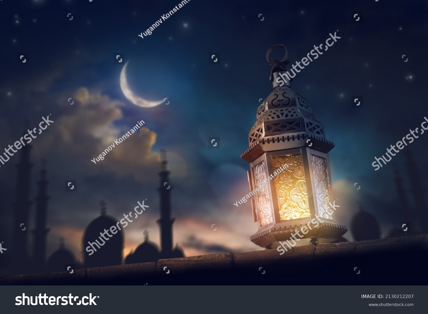 Ornamental Arabic lantern with burning candle glowing at night. Festive greeting card, invitation for Muslim holy month Ramadan Kareem. #2130212207