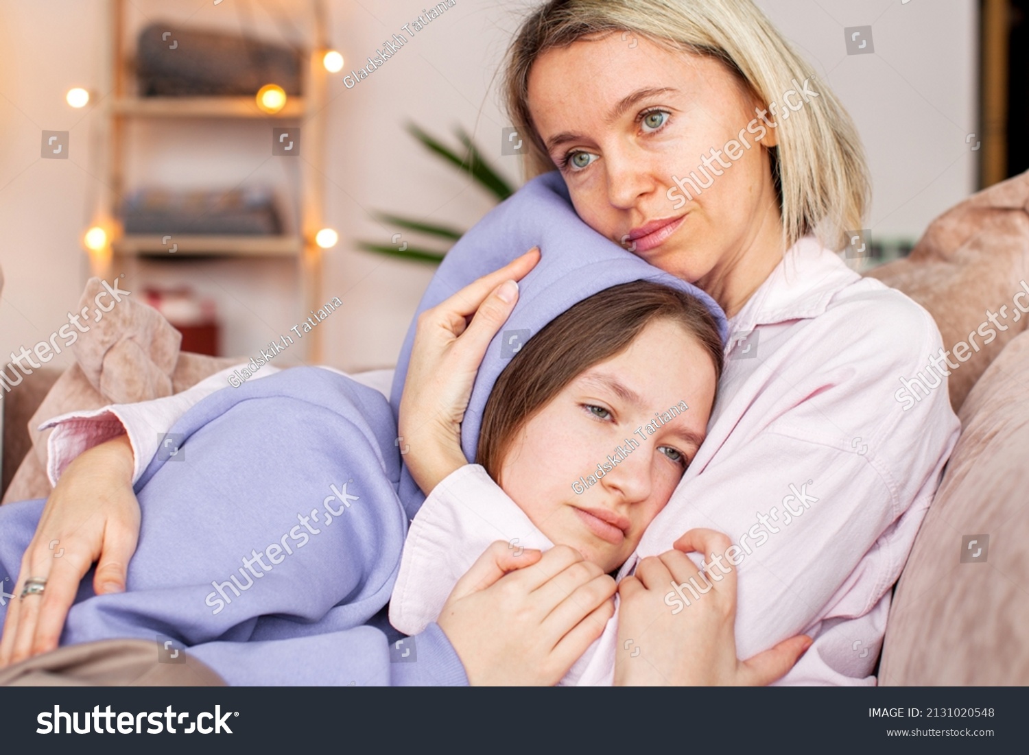 Caring Caucasian mother talk comfort unhappy sad teenage daughter suffering from school bullying or psychological problems, loving mom support make peace with depressed introvert teen girl child #2131020548
