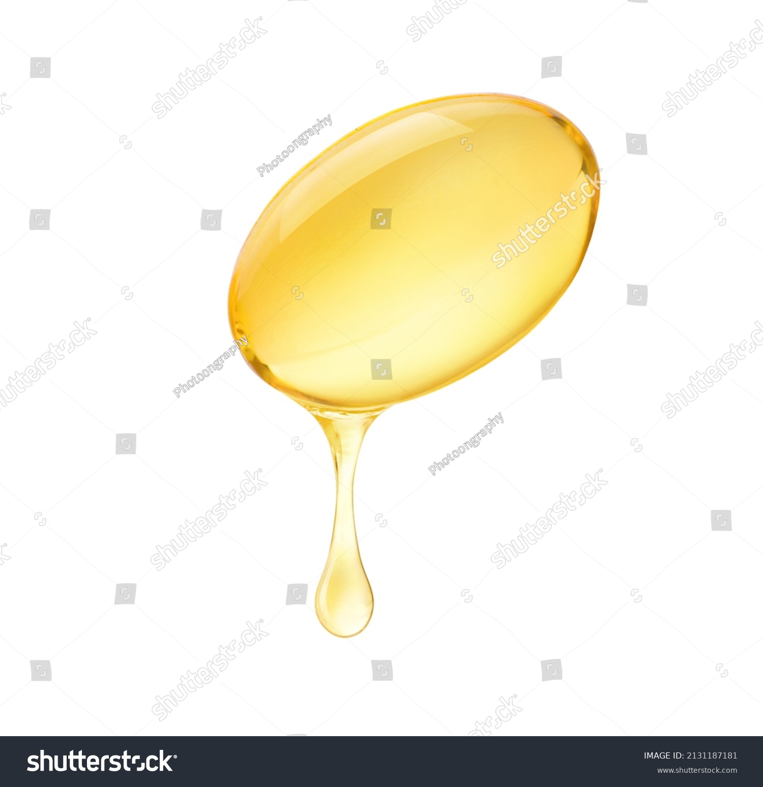 Oil dripping from soft gel capsule isolated on white background. #2131187181