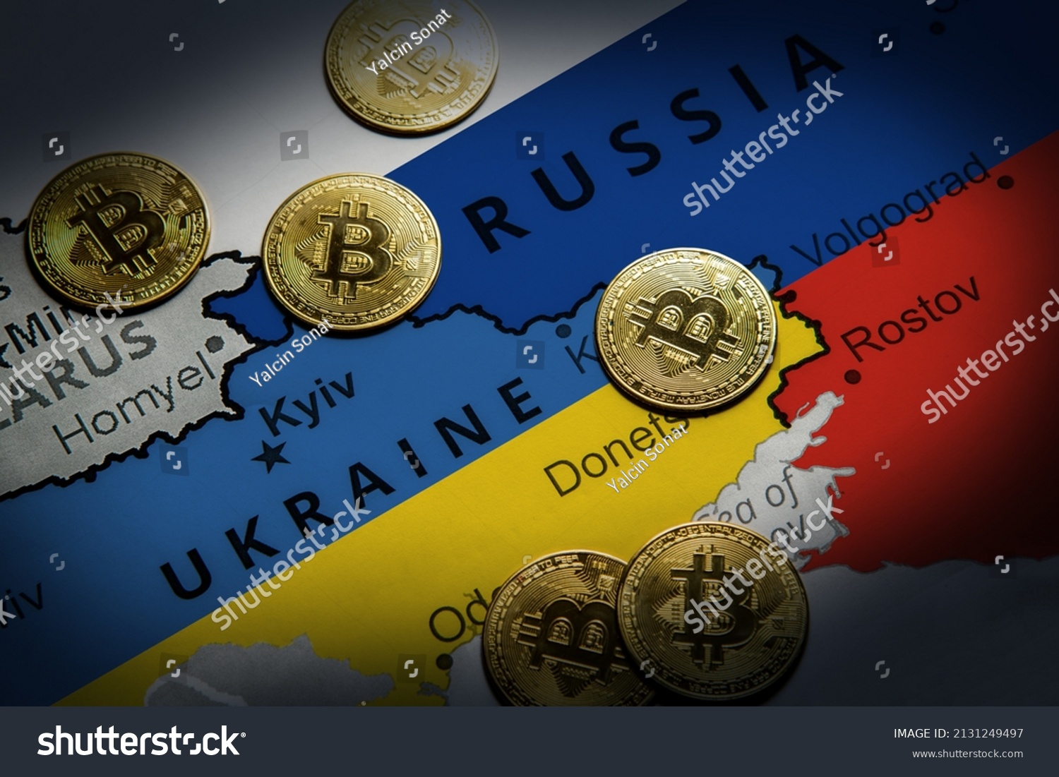 Cryptocurrency standing on the map of Russia and Ukraine. Concept of precaution against financial sanctions #2131249497