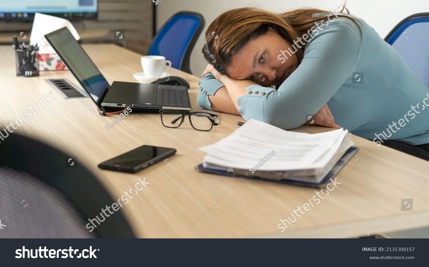 A tired employee experiences a period of burnout at work.Physical and emotional exhaustion of an employee.Burnout concept. #2131300157