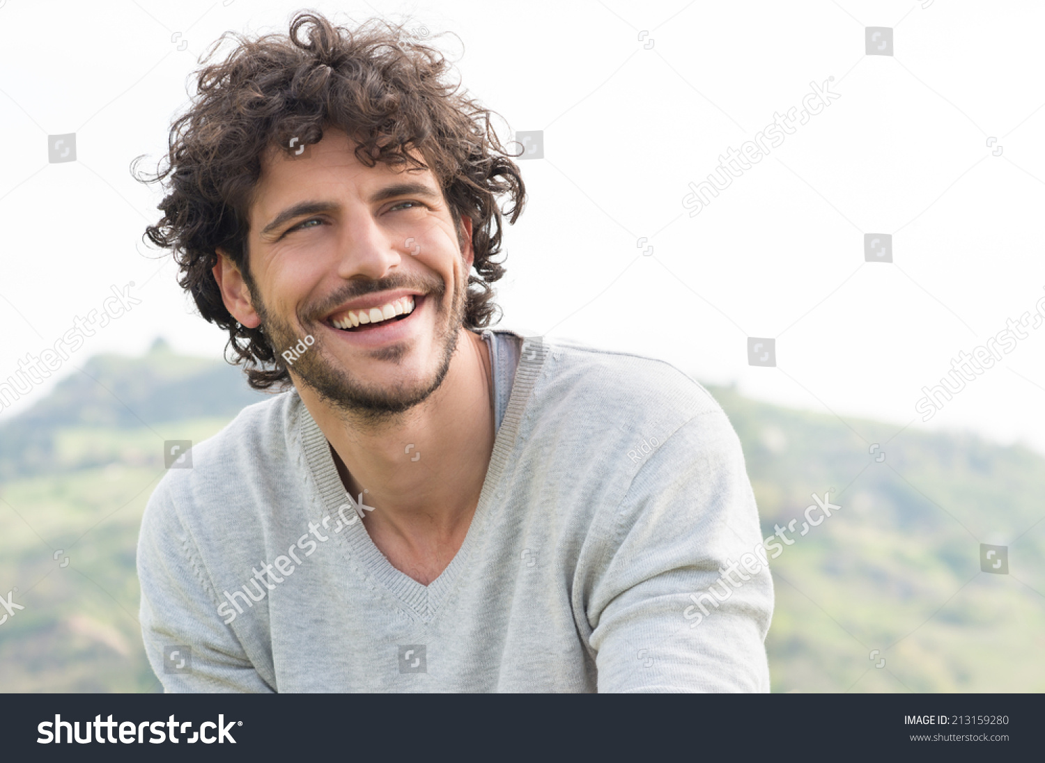 Portrait Of Young Handsome Man Smiling Outdoor #213159280
