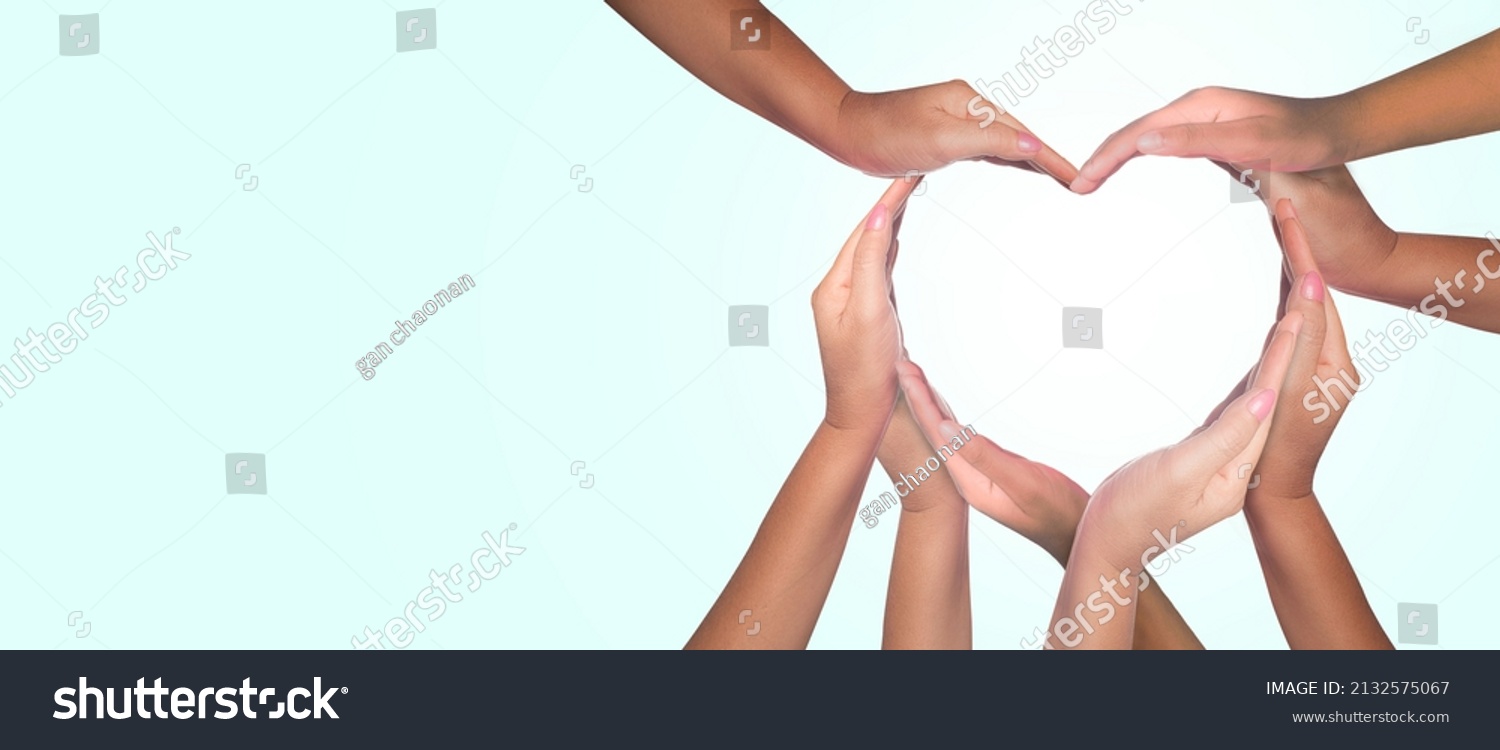 International Human Solidarity Day concept: Unity and diversity are at the heart of a diverse group of people connected together as a supportive symbol that represents a sense of teamwork.  #2132575067