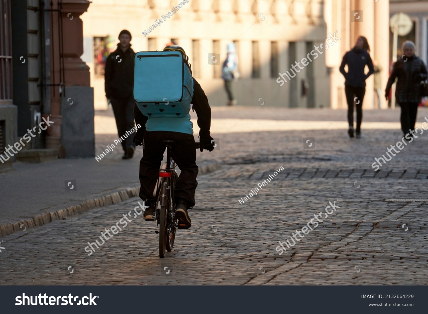 Courier On Bicycle Delivering Food In City #2132664229