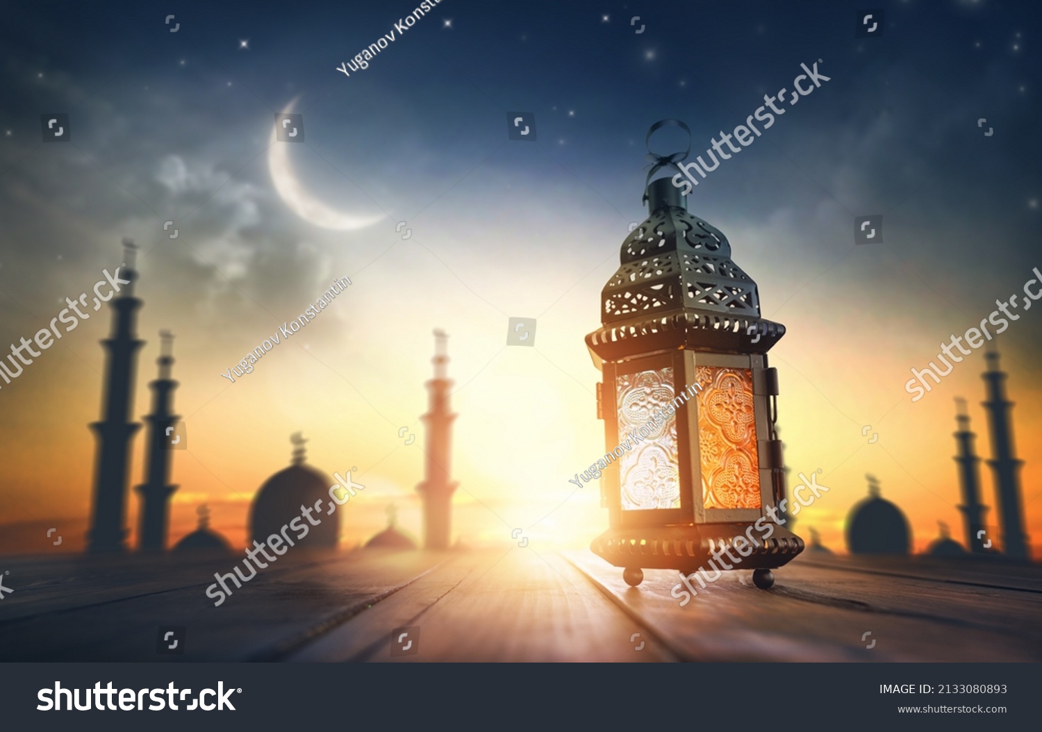 Ornamental Arabic lantern with burning candle glowing at night. Festive greeting card, invitation for Muslim holy month Ramadan Kareem. #2133080893
