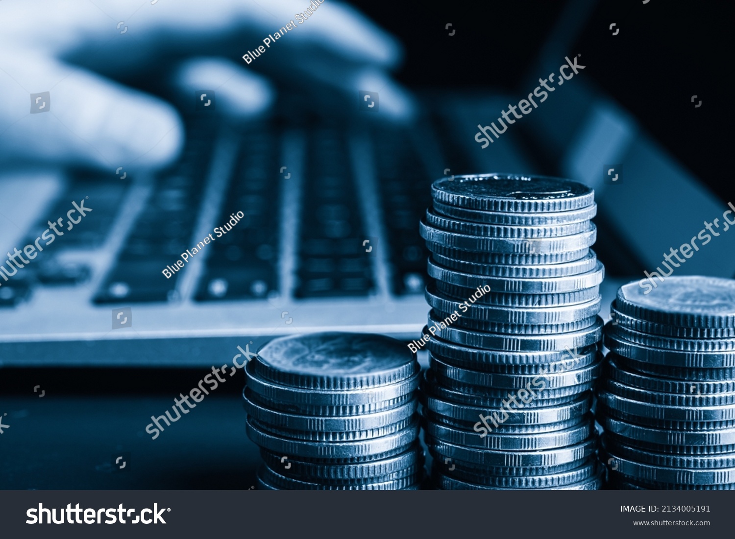 Pile of gold coins money stack in finance treasury deposit bank account saving . Concept of corporate business economy and financial growth by investment in valuable asset to gain cash revenue . #2134005191