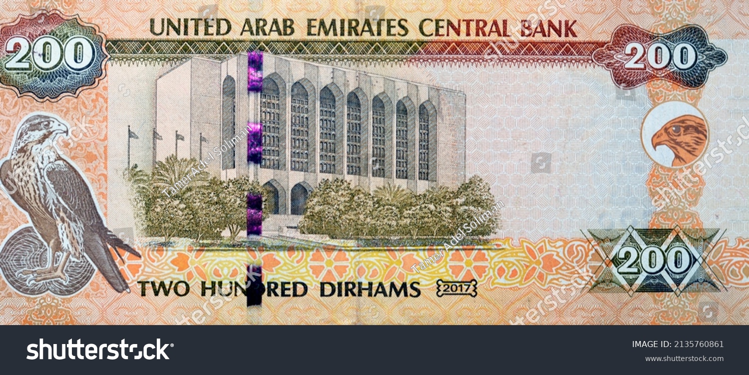 Large fragment of reverse side of 200 AED two hundred Dirhams banknote of United Arab Emirates that features the imagery of the Central Bank of the UAE and a falcon image, Emirates money banknote #2135760861